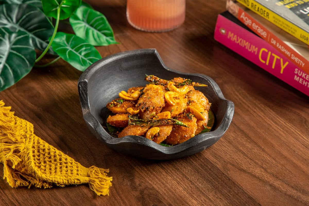 Gunpowder idli which is stir-fried in pure ghee and seasoned with traditional milagai podi masala, cashews and fragrant curry leaves